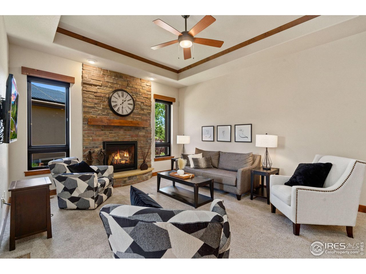 6611 Murano Drive Windsor, CO 80550 - Photo 6 of 35 a living room with furniture and a fireplace