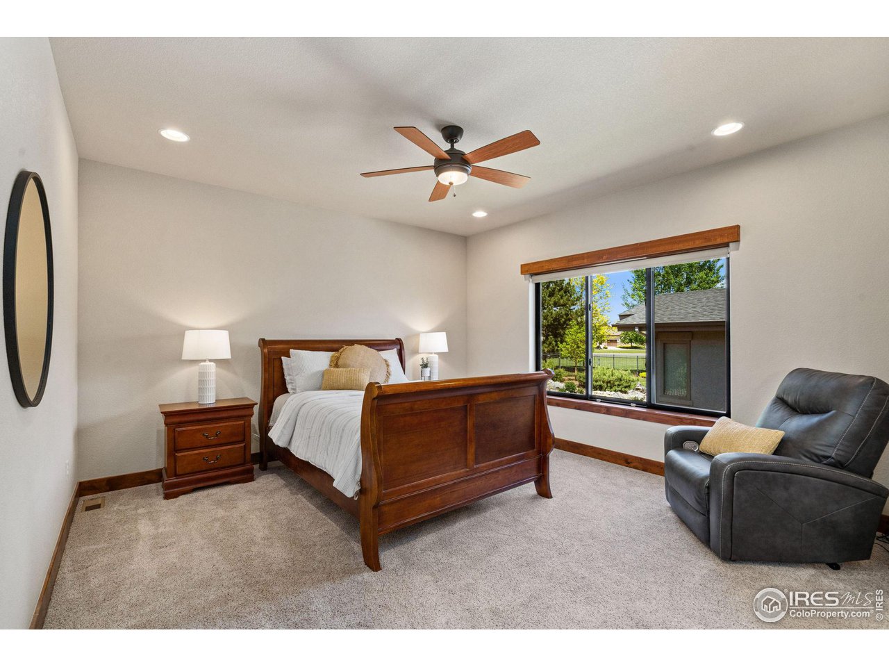 6611 Murano Drive Windsor, CO 80550 - Photo 9 of 35 a living room with furniture and a large window