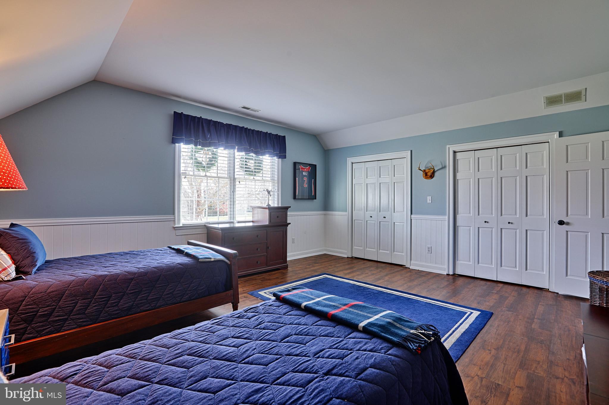 2902 Cox Neck Road East Chester, MD 21619 - Photo 33 of 57 a bedroom with two beds and a window