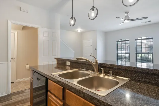 a kitchen with a sink and a window