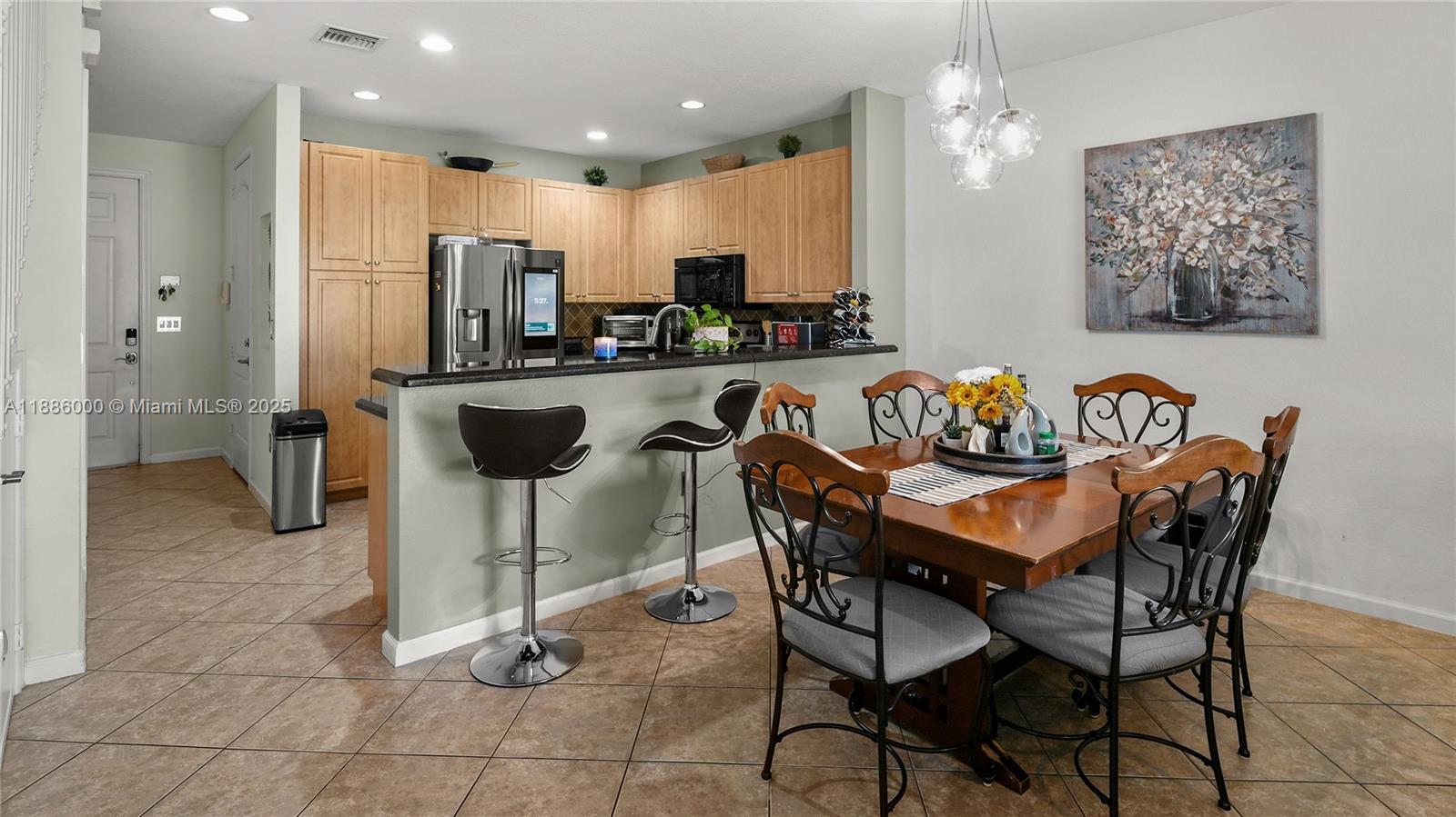 7717 Paddock Place Davie, FL 33328 - Photo 2 of 11 a view of a dining room with furniture