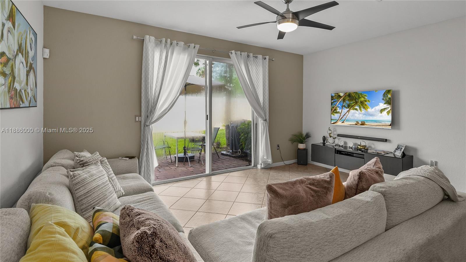 7717 Paddock Place Davie, FL 33328 - Photo 5 of 11 a living room with furniture and a large window