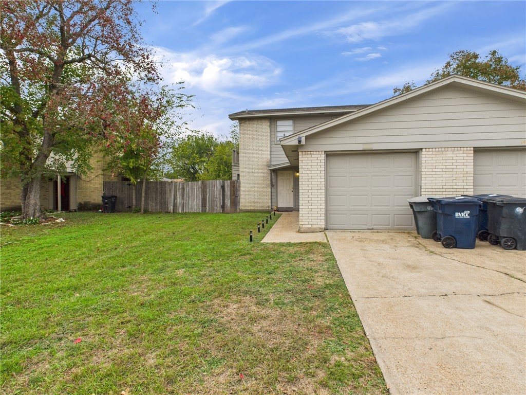 a backyard of a house with table and chairs