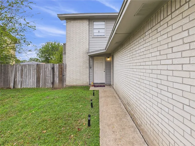 a view of a pathway with a house