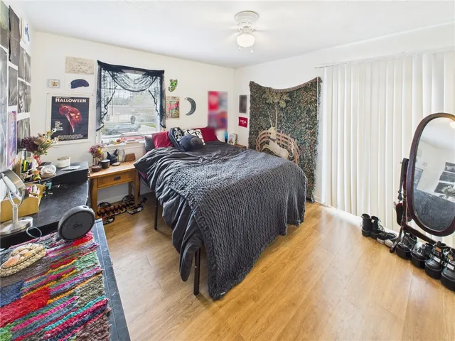 a bed room with a bed and a furniture