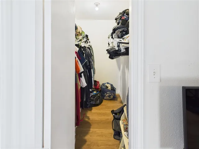 a view of a closet with storage