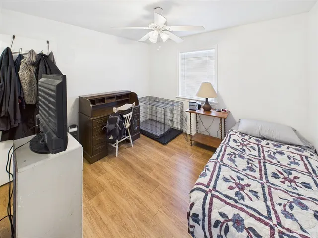 a bedroom with furniture and a window