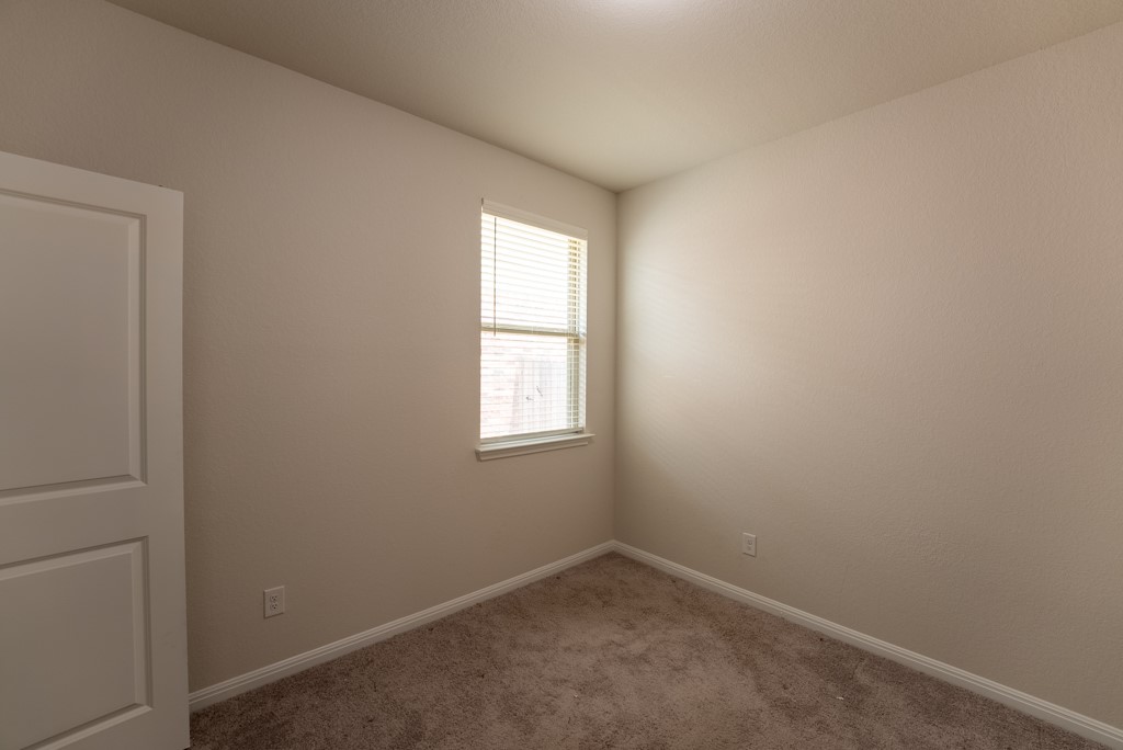 6310 Wolf Pack Drive Pflugerville, TX 78660 - Photo 22 of 34 an empty room with a window