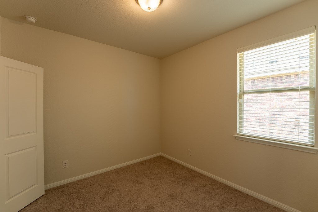 6310 Wolf Pack Drive Pflugerville, TX 78660 - Photo 24 of 33 an empty room with a window