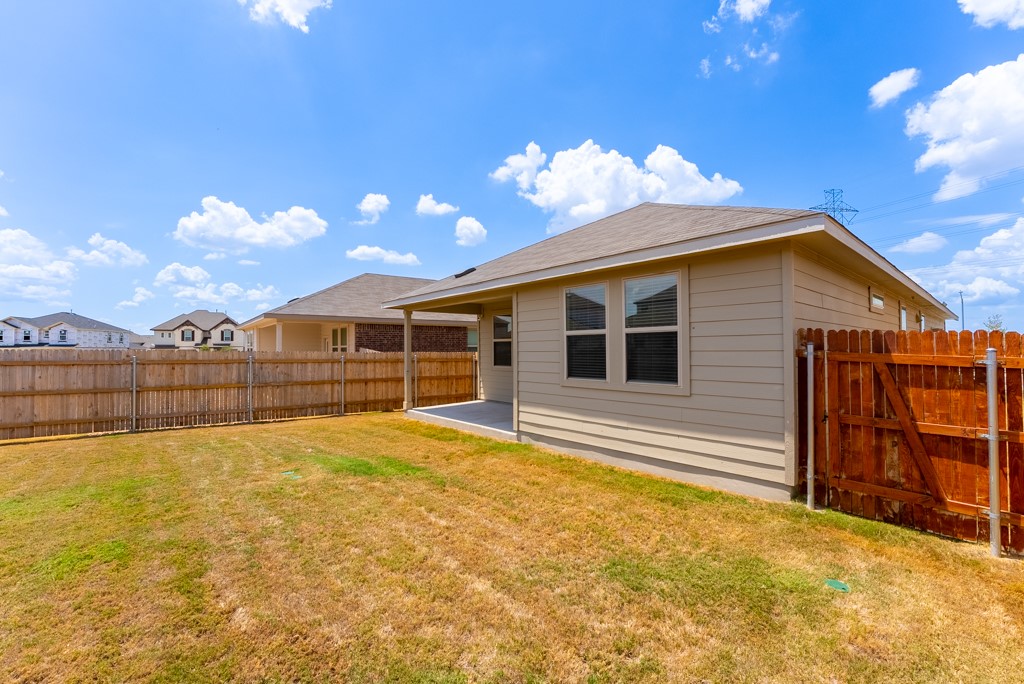 6310 Wolf Pack Drive Pflugerville, TX 78660 - Photo 29 of 33 a view of a house with wooden fence
