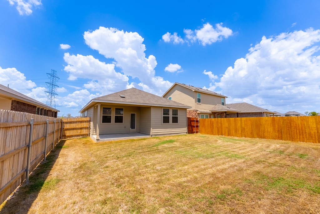 6310 Wolf Pack Drive Pflugerville, TX 78660 - Photo 29 of 34 a view of a house with wooden fence