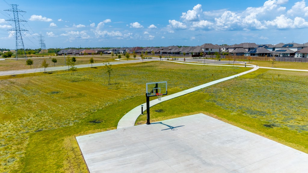 6310 Wolf Pack Drive Pflugerville, TX 78660 - Photo 32 of 34 a view of a swimming pool with an ocean view