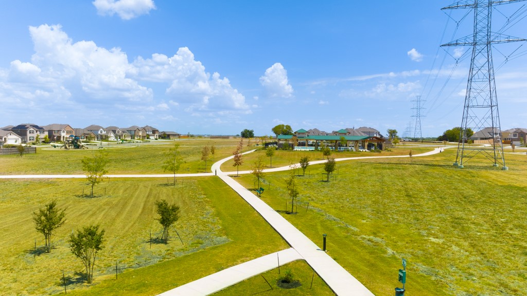 6310 Wolf Pack Drive Pflugerville, TX 78660 - Photo 32 of 33 a view of an swimming pool with an ocean view