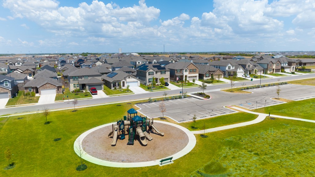 6310 Wolf Pack Drive Pflugerville, TX 78660 - Photo 34 of 34 a view of a swimming pool with a yard