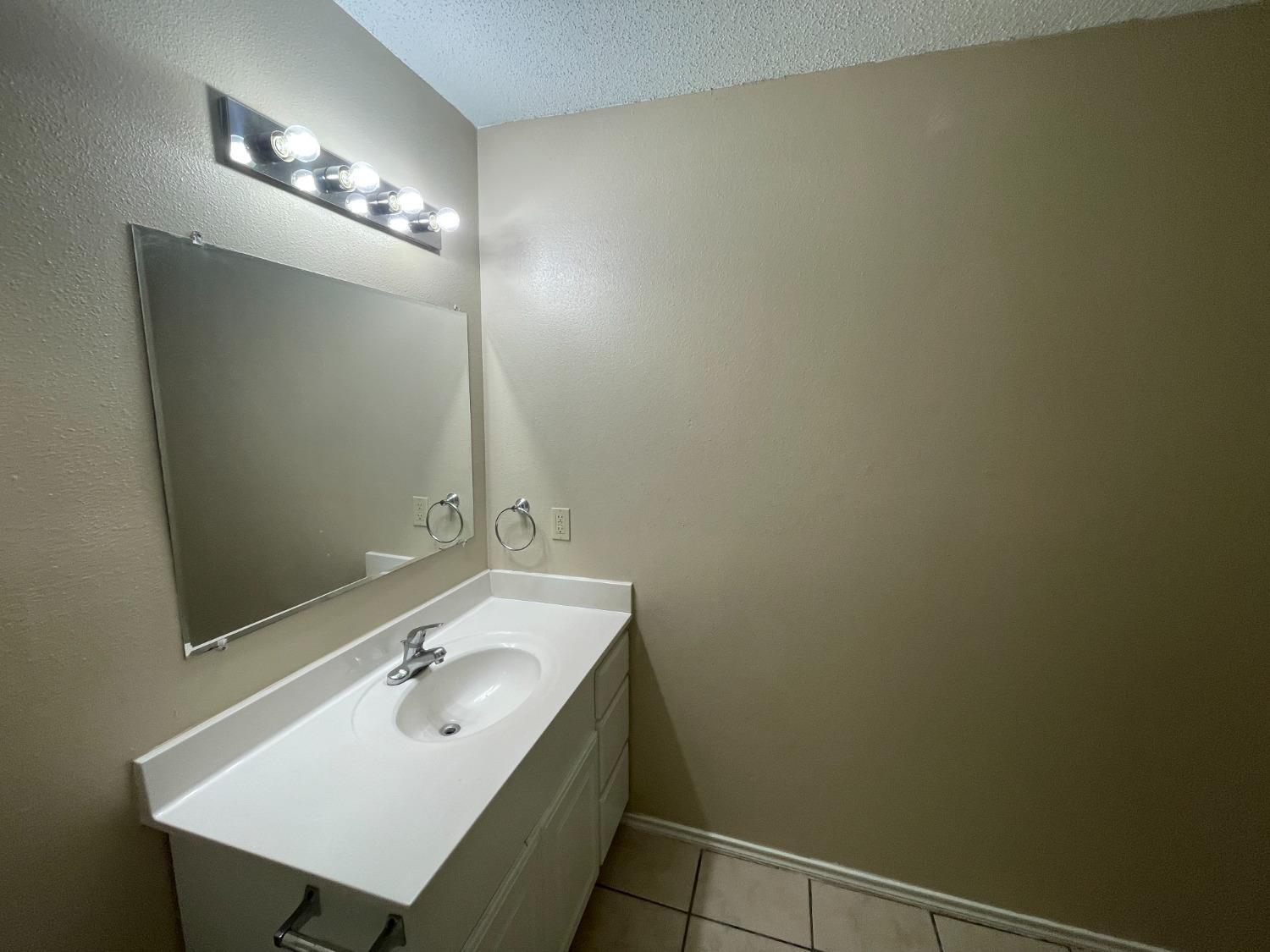 5827 6th Street Lubbock, TX 79416 - Photo 12 of 14 Hall Bathroom