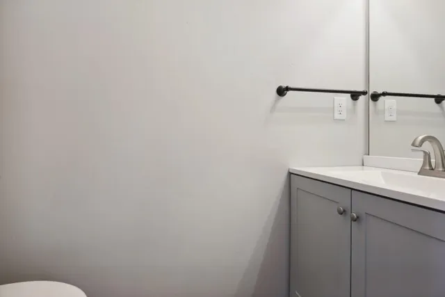 a bathroom with a sink and mirror