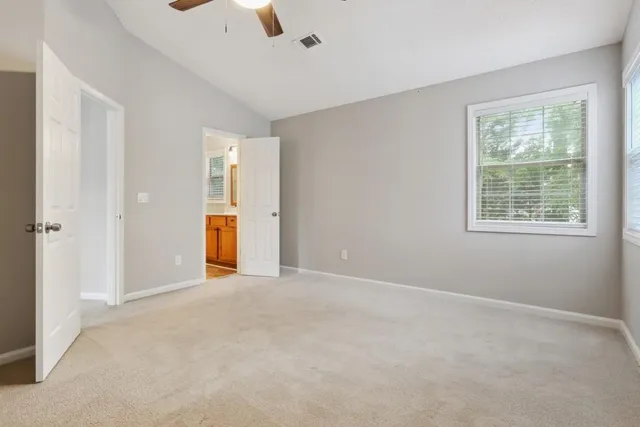 a view of an empty room with a window