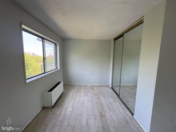a living room with furniture rug and a window