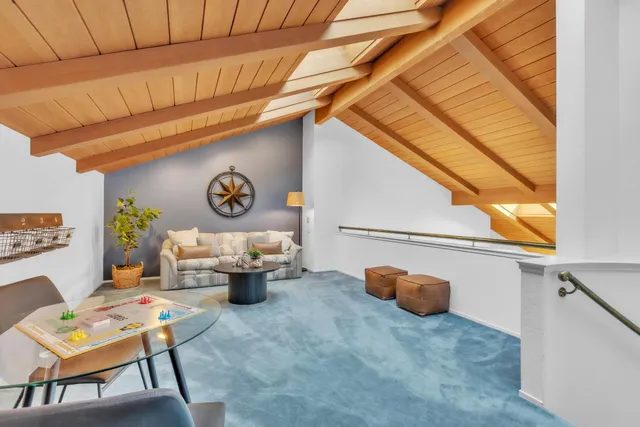 a bed room with a bed and a large window