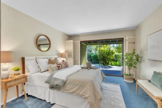 a kitchen with a refrigerator and a stove