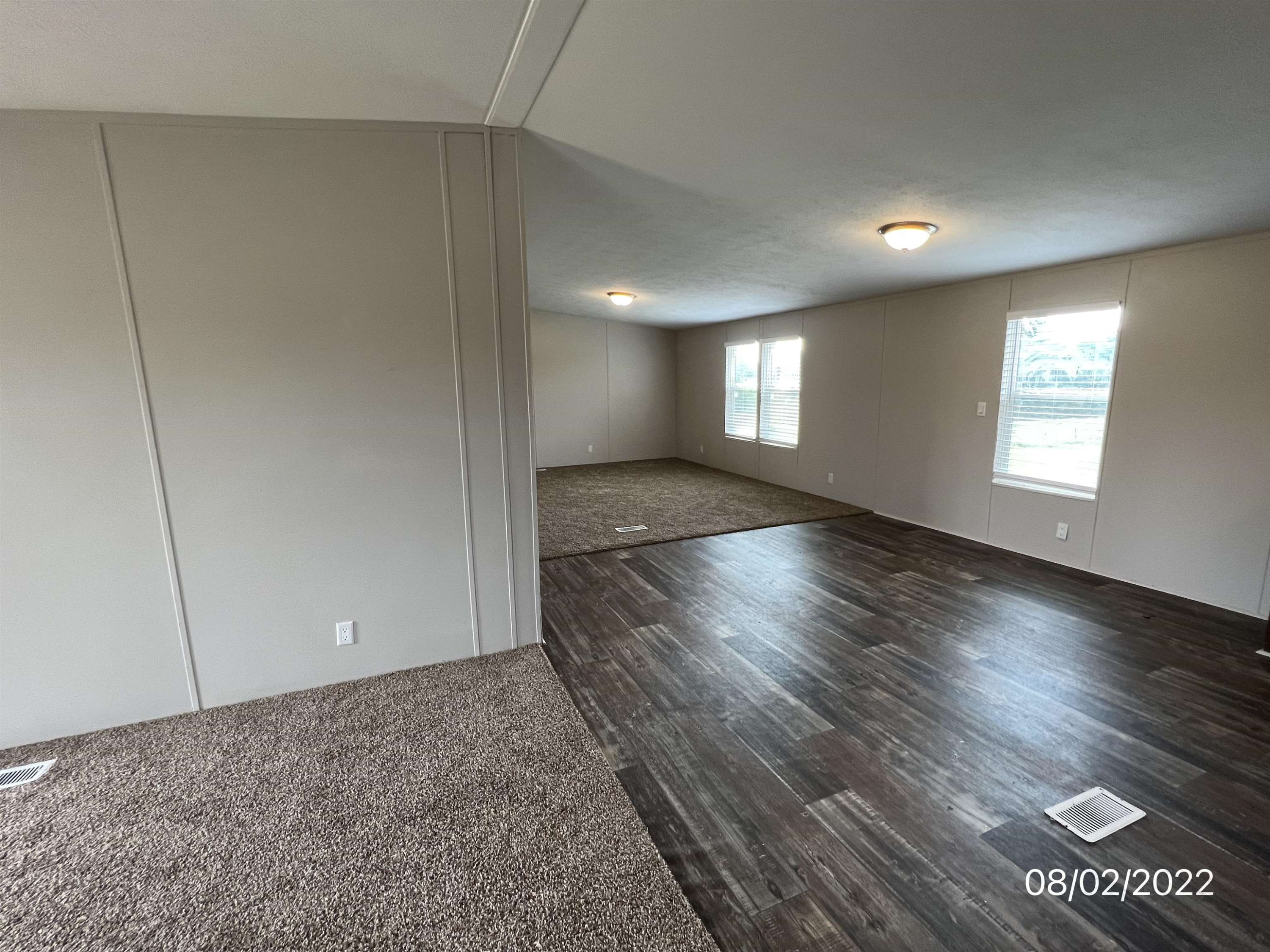 598 Key Road Troy, TN 38260 - Photo 12 of 25 an empty room with wooden floor and windows