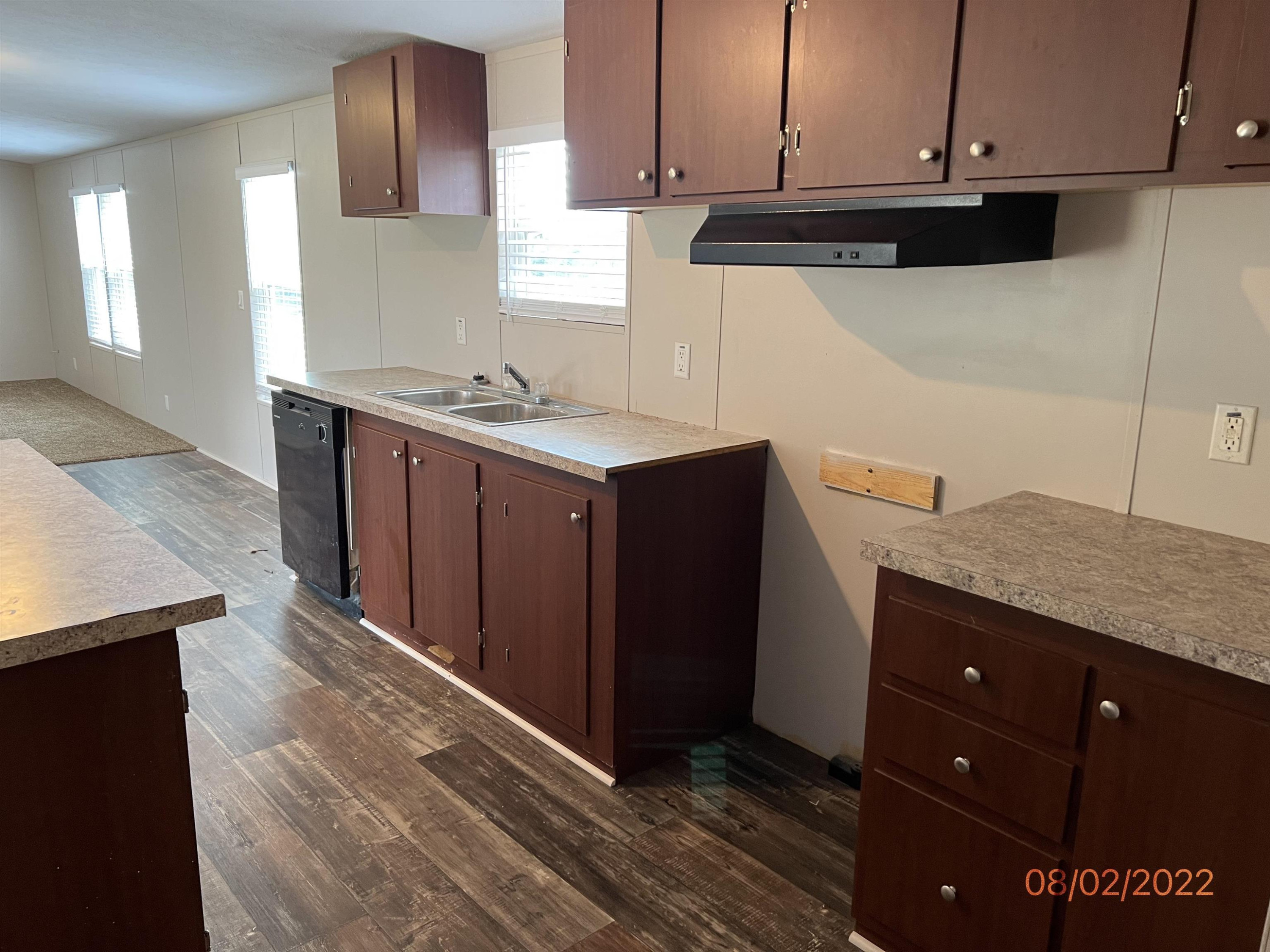 598 Key Road Troy, TN 38260 - Photo 8 of 25 a kitchen with stainless steel appliances granite countertop a sink and cabinets