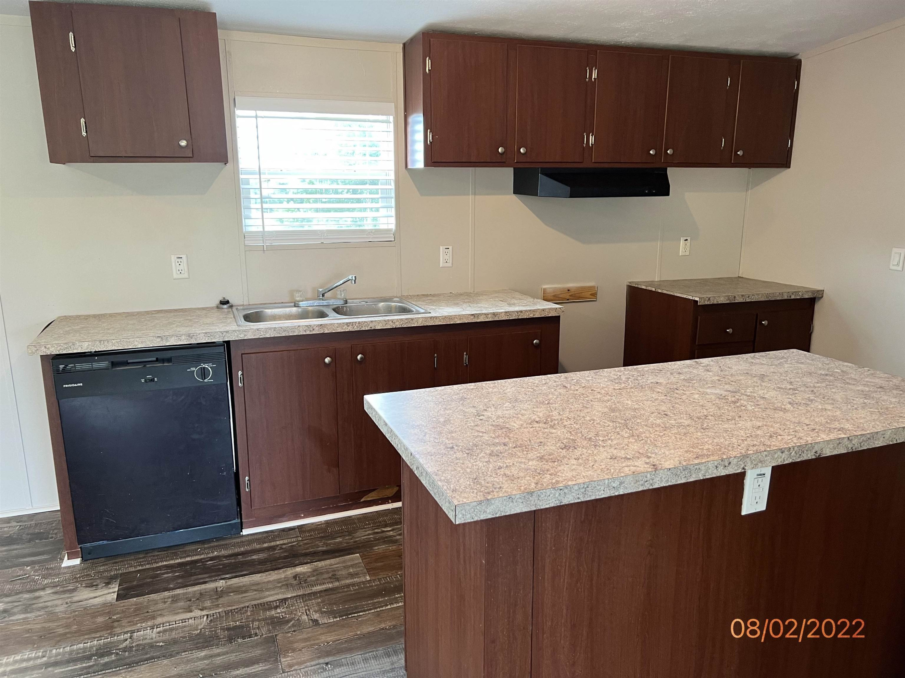 598 Key Road Troy, TN 38260 - Photo 9 of 25 a kitchen with a sink a cabinets and wooden floor