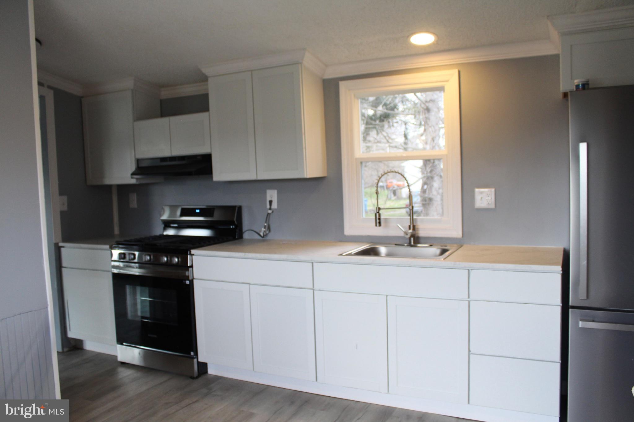115 Santilli Road Landenberg, PA 19350 - Photo 8 of 15 Modern kitchen with sleek finishes.