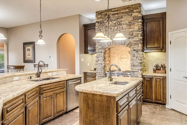 a stove top oven sitting inside of a kitchen