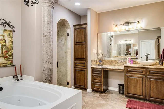 a bathroom with a shower and a sink