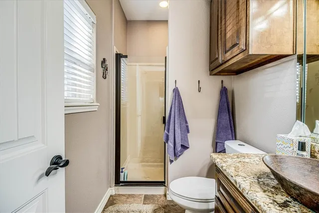 a outdoor living space with patio furniture and a fireplace