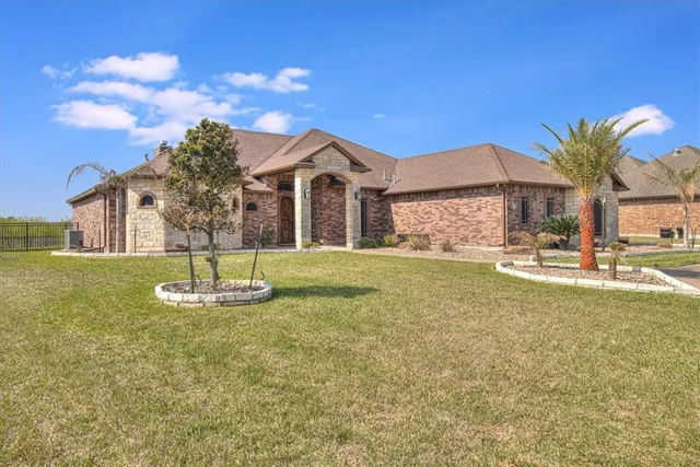 a front view of a house with a yard