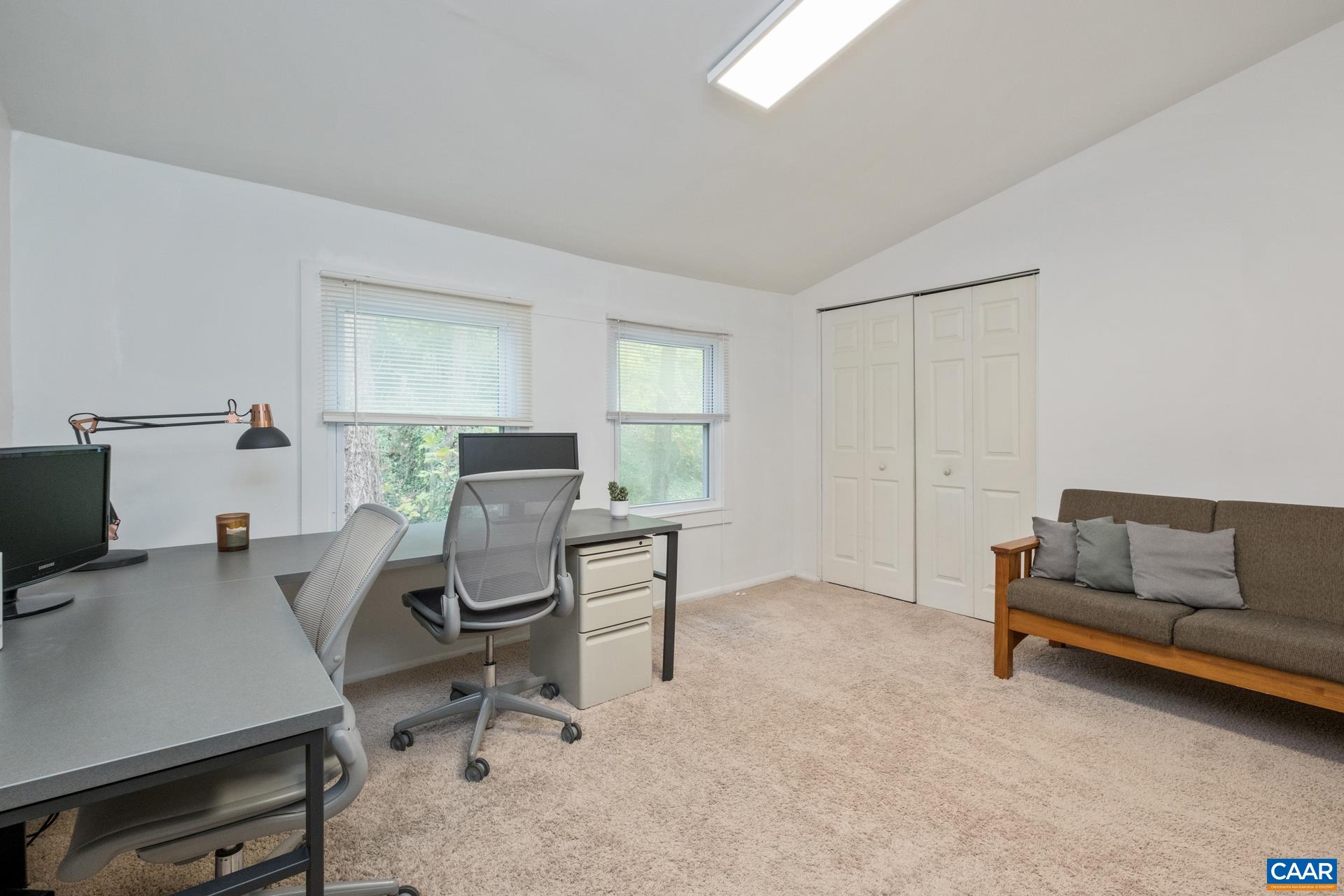 407 Valley Rd Extension, Unit A Charlottesville, VA 22903 - Photo 14 of 24 a view of a livingroom with workspace and a couch
