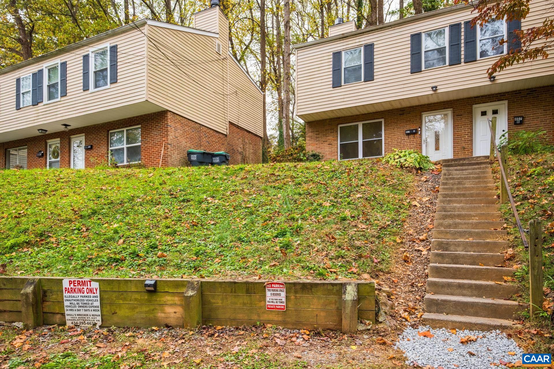 407 Valley Rd Extension, Unit A Charlottesville, VA 22903 - Photo 23 of 24 a front view of a house with a yard and potted plants