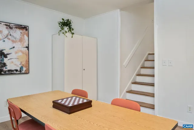 a bedroom with a bed and a table