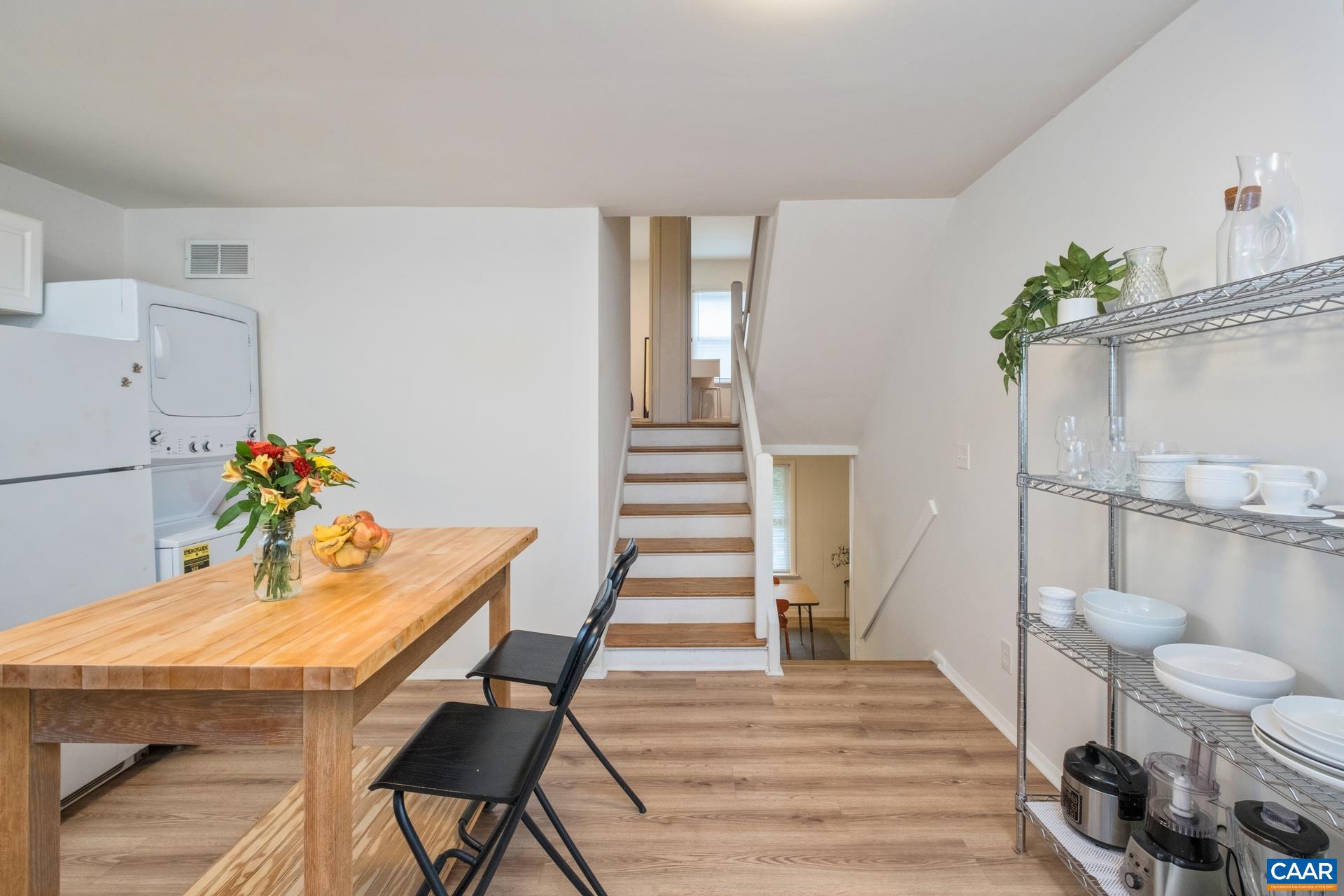 407 Valley Rd Extension, Unit A Charlottesville, VA 22903 - Photo 9 of 24 a view of a dining room with furniture and wooden floor