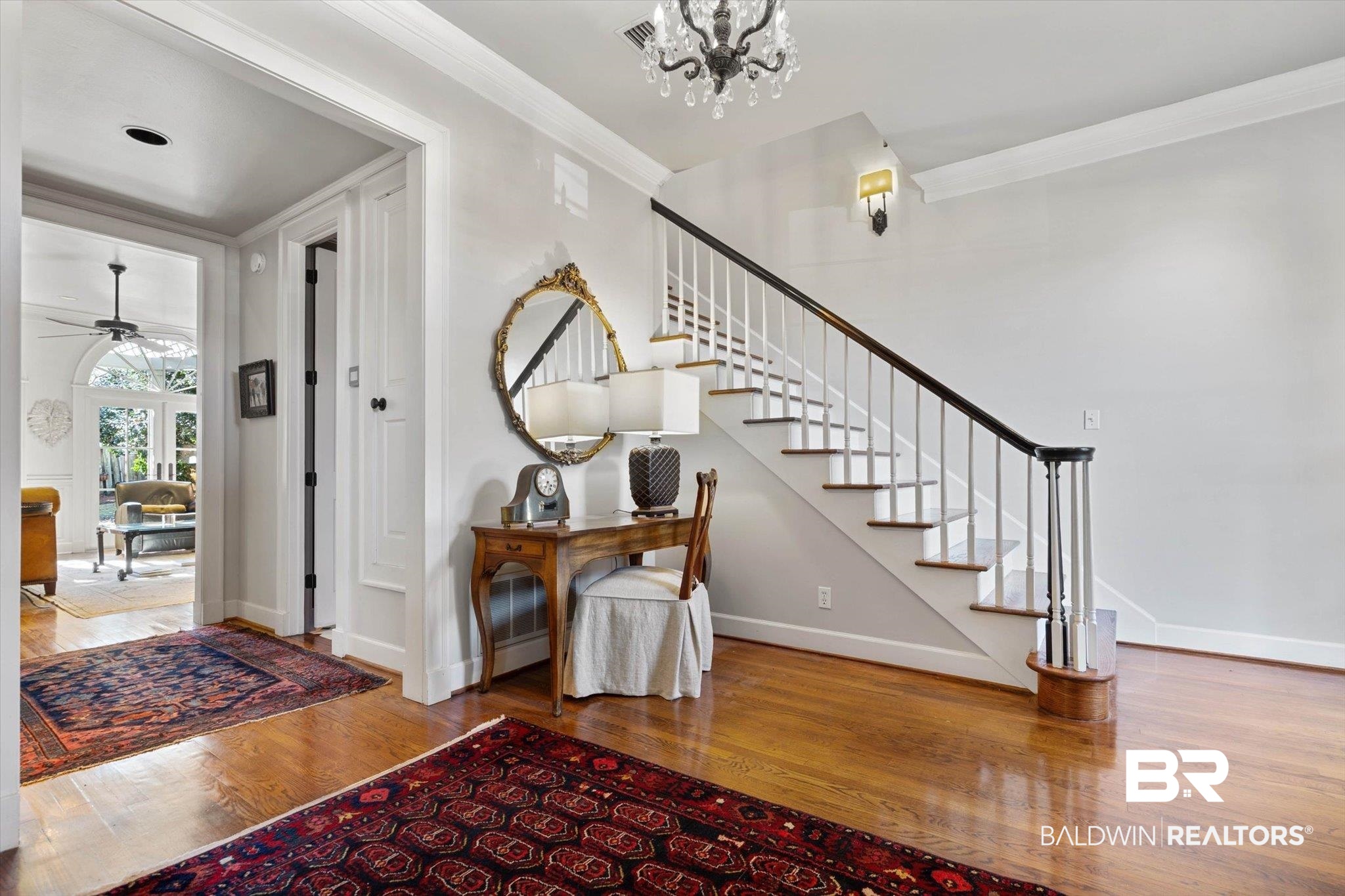 3615 Stein Street Mobile, AL 36608 - Photo 3 of 44 Foyer entrance featuring crown molding, wood-type flooring, ceiling fan, a chandelier, and stairs