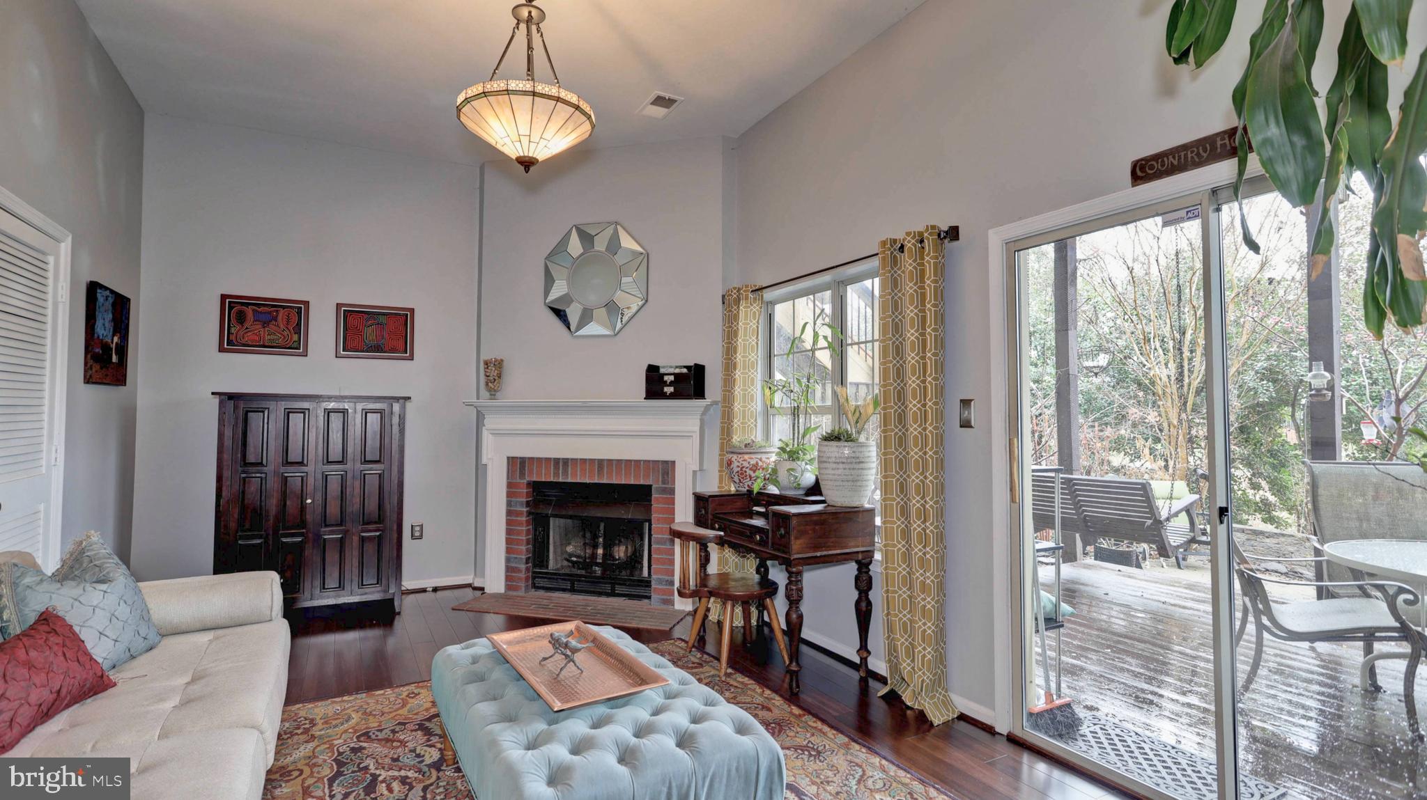 44072 Florence Terrace Ashburn, VA 20147 - Photo 11 of 31 a living room with furniture fireplace and a large window