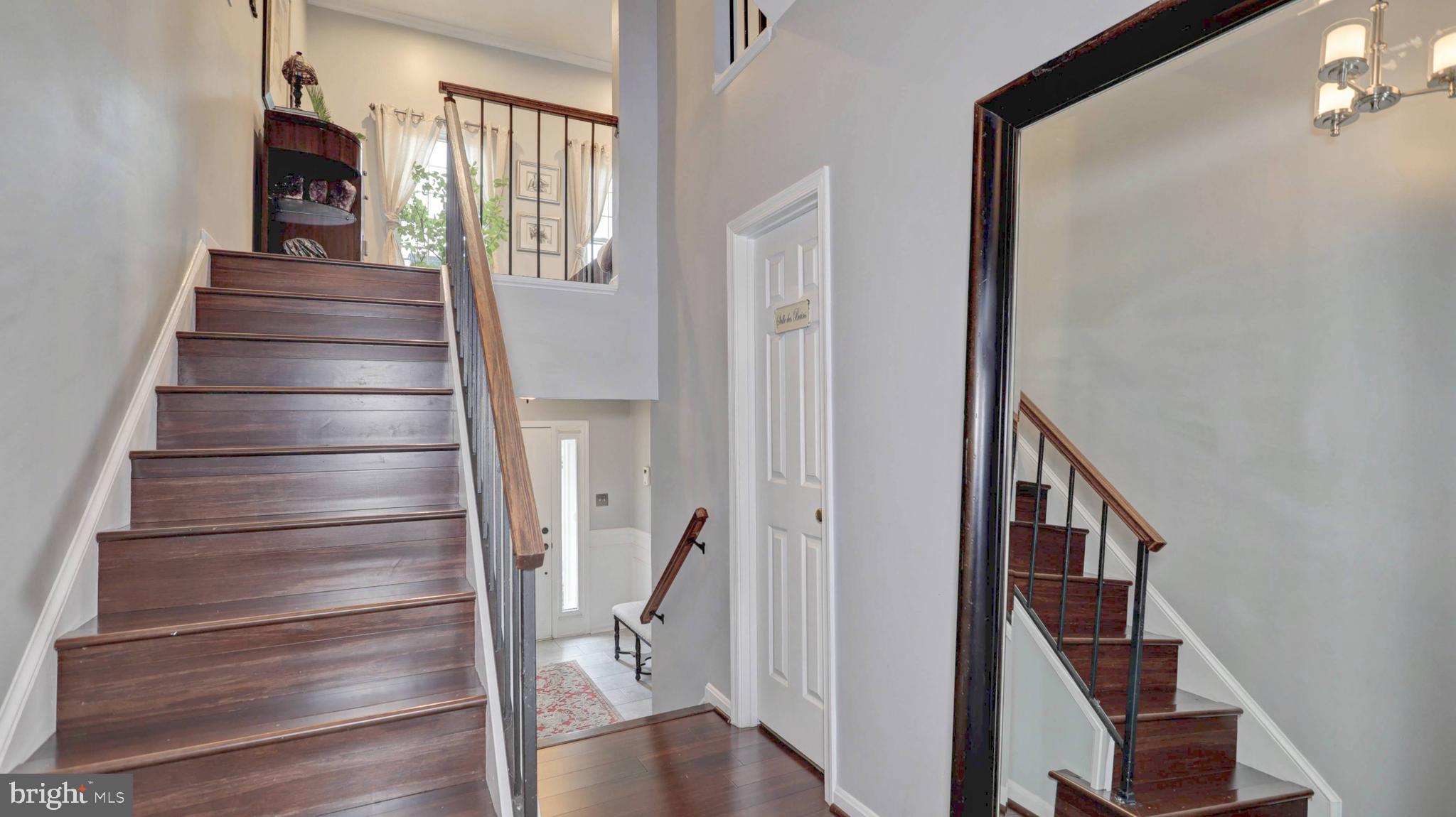 44072 Florence Terrace Ashburn, VA 20147 - Photo 15 of 31 a view of entryway with wooden floor and stairs