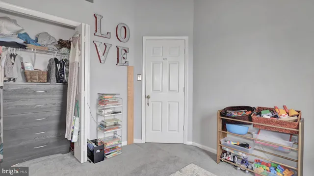 a table and chairs in patio of the house