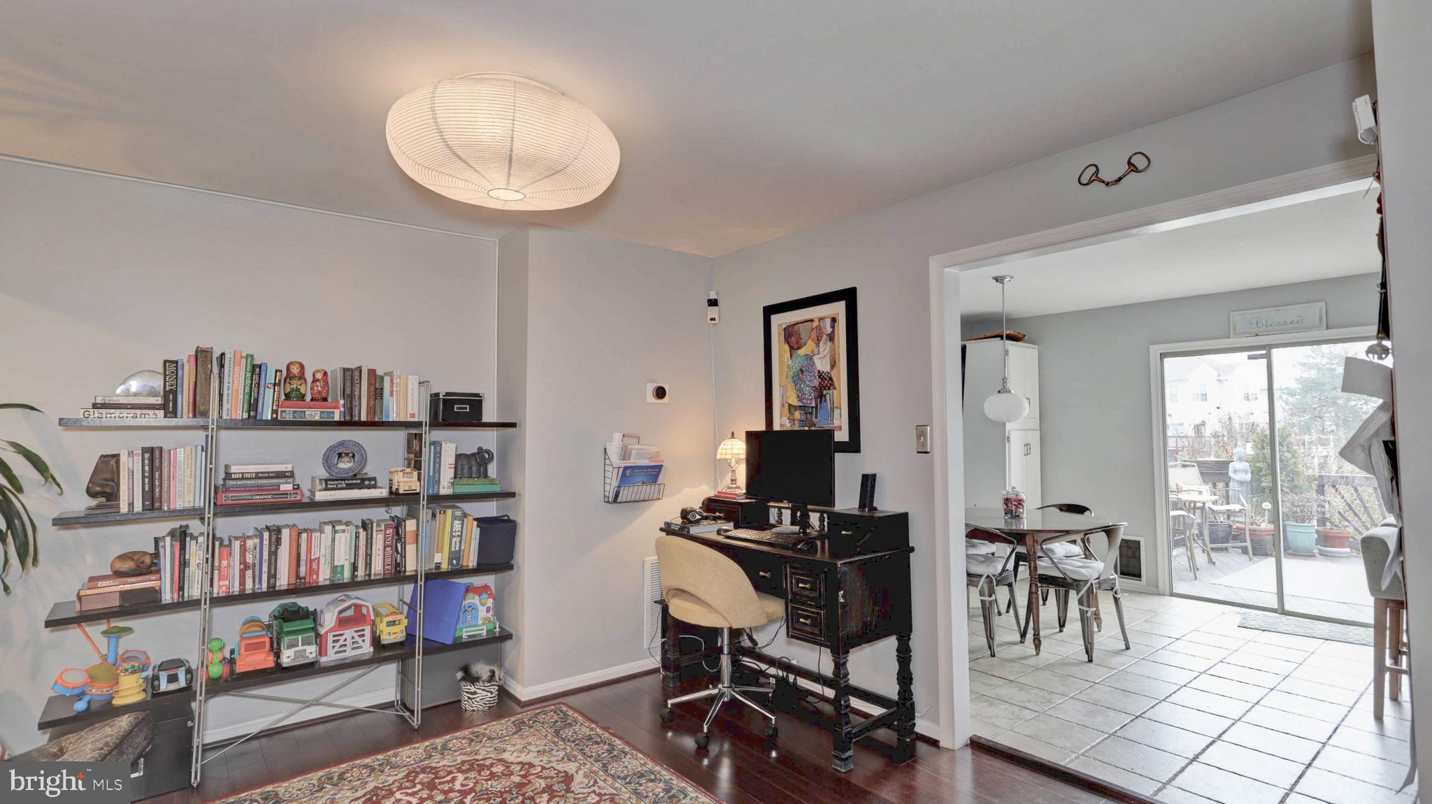 44072 Florence Terrace Ashburn, VA 20147 - Photo 10 of 31 a view of a workspace with furniture and a book shelf