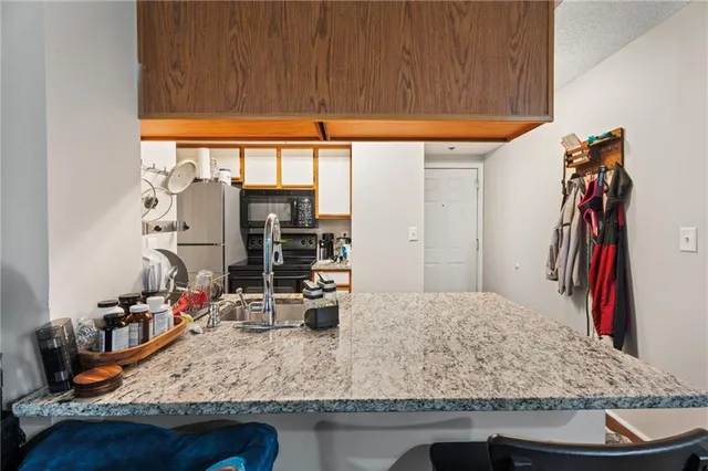 a view of a kitchen with kitchen island and a window