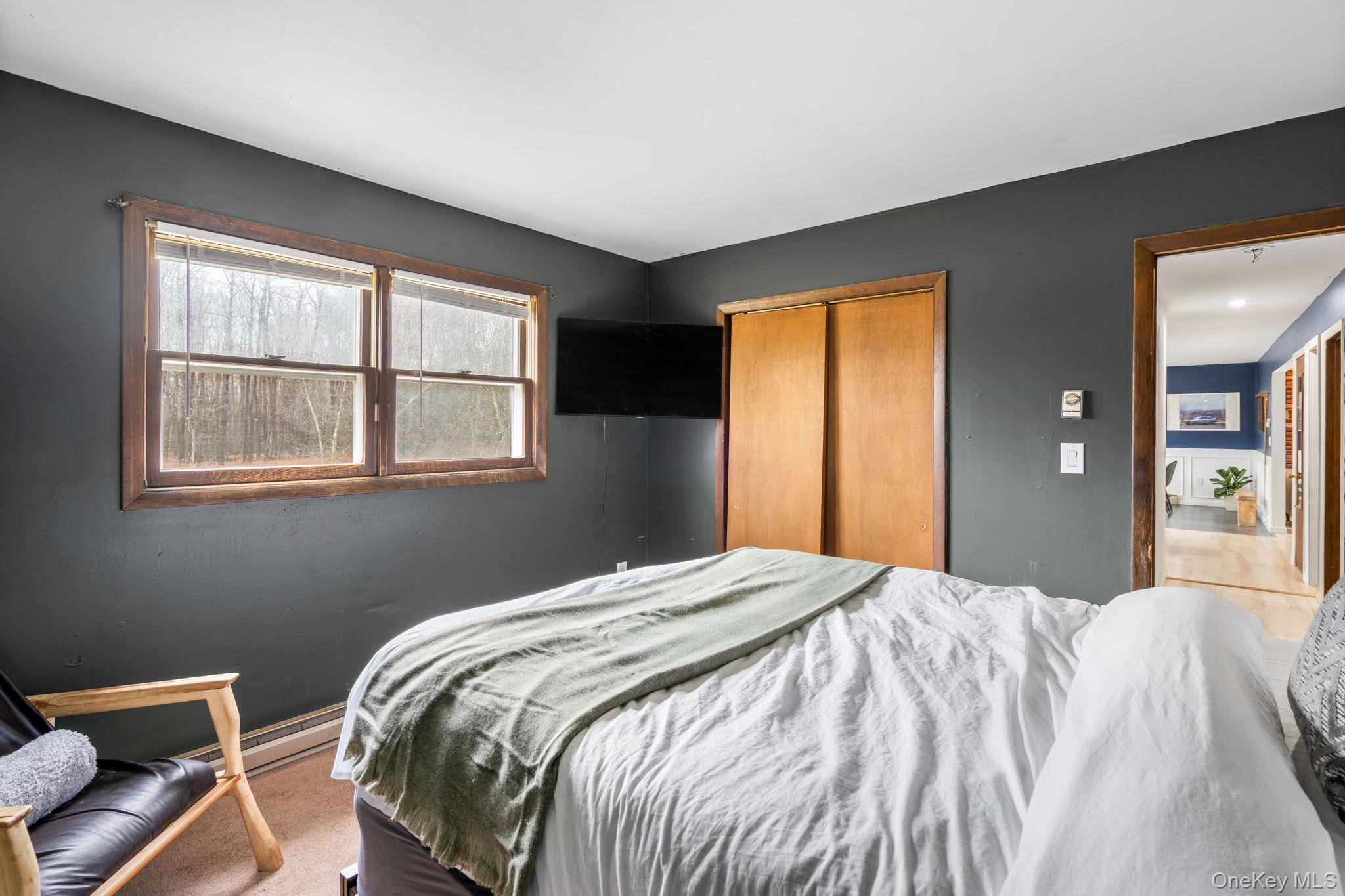 178 Bowers Road Loch Sheldrake, NY 12759 - Photo 18 of 47 a bedroom with a bed and a window