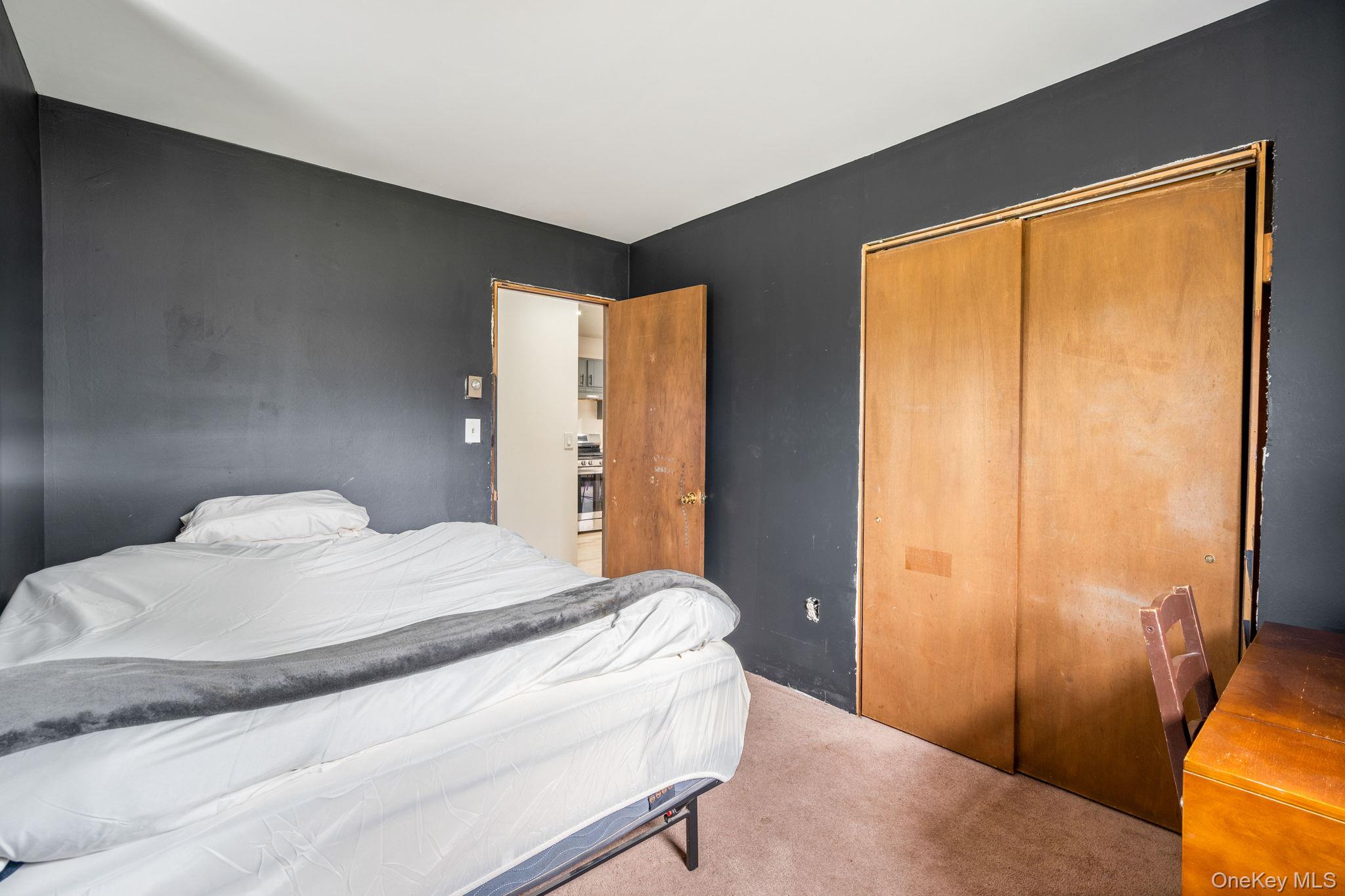 178 Bowers Road Loch Sheldrake, NY 12759 - Photo 21 of 47 a bedroom with a bed and a large window