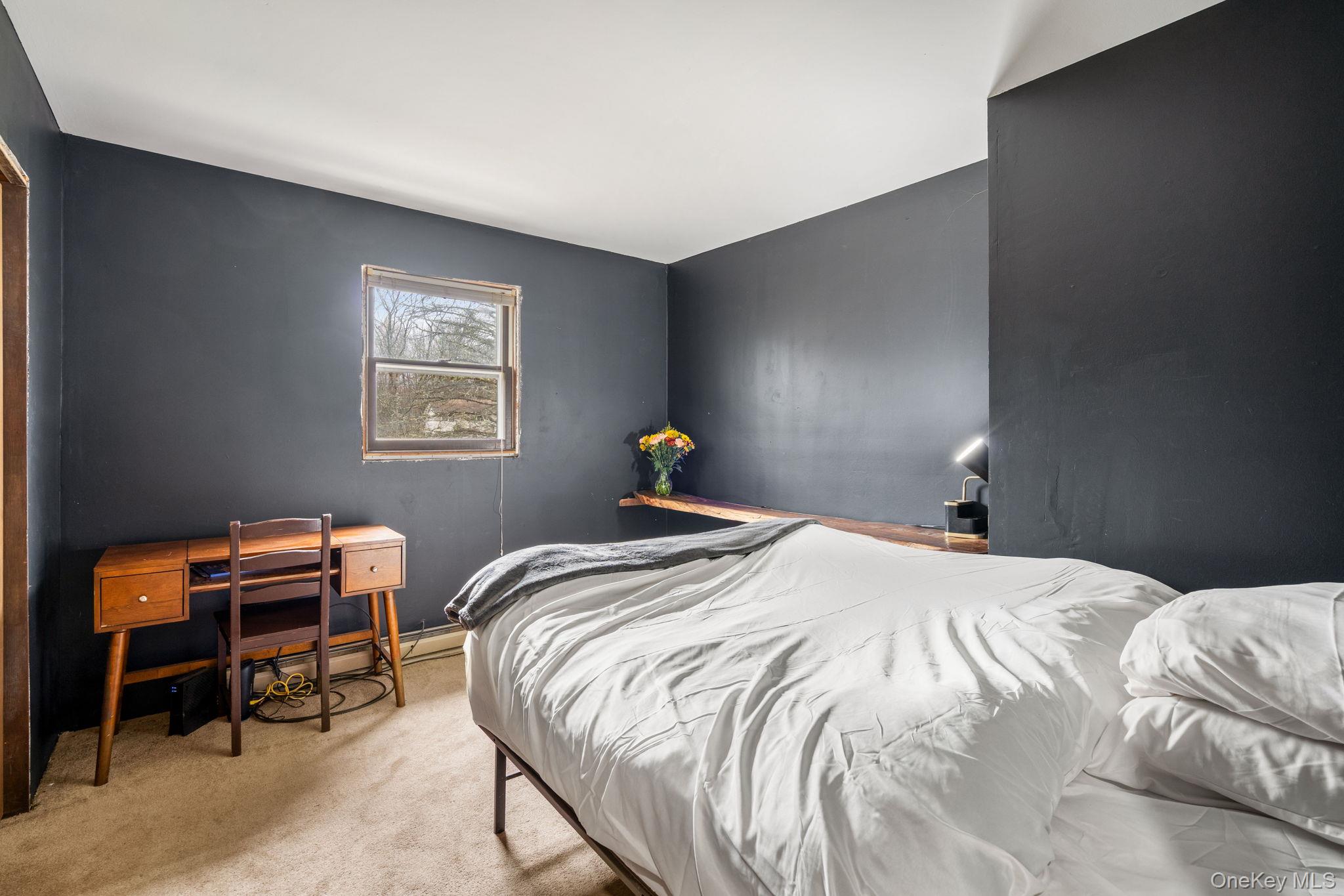 178 Bowers Road Loch Sheldrake, NY 12759 - Photo 22 of 47 a bedroom with a bed and a window