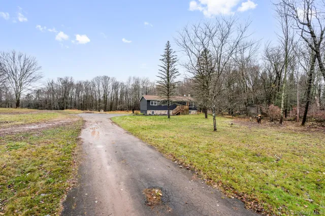 a swimming pool with some trees in the background