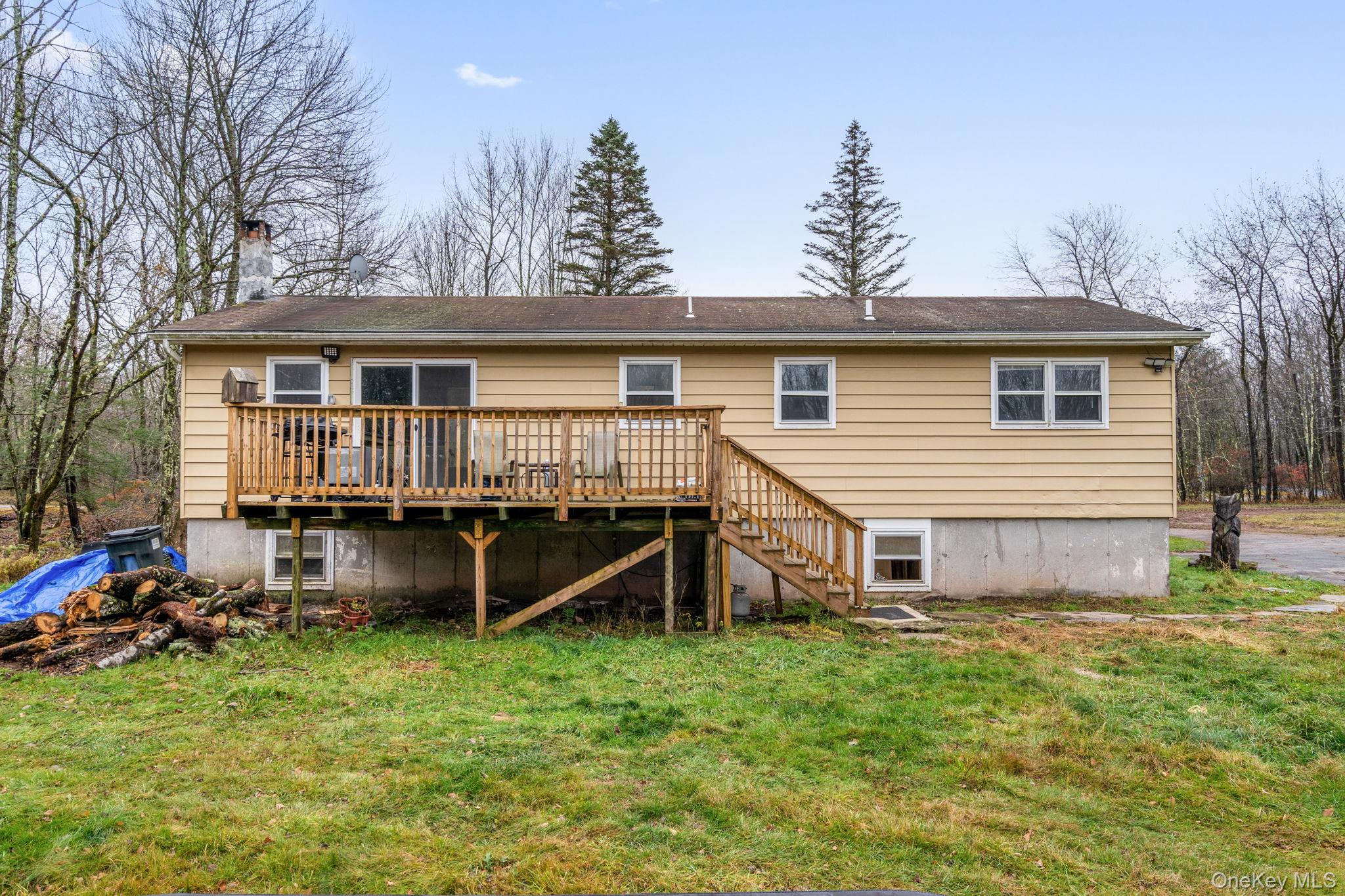 178 Bowers Road Loch Sheldrake, NY 12759 - Photo 46 of 47 a view of a house with a yard and wooden fence