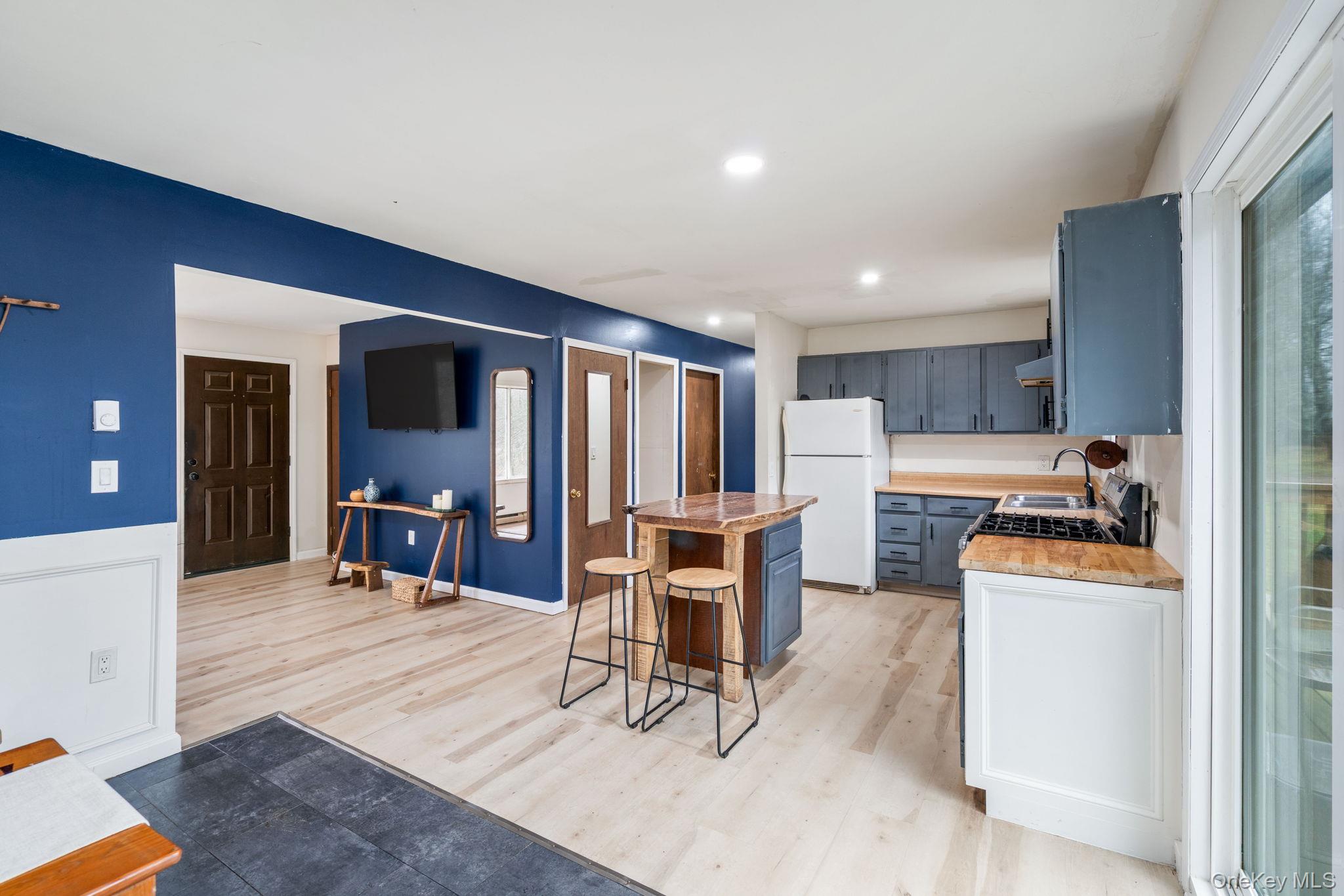 178 Bowers Road Loch Sheldrake, NY 12759 - Photo 9 of 47 a living room with furniture and a kitchen