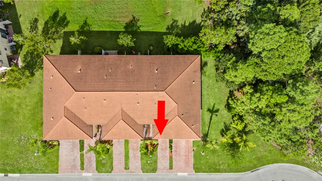 an aerial view of house with yard