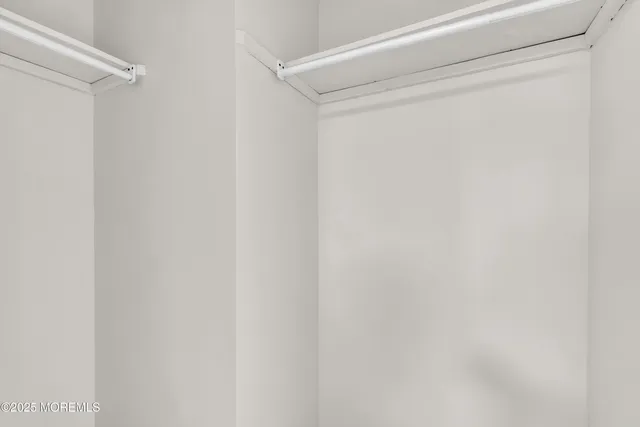 a kitchen with granite countertop a sink a stove and cabinets